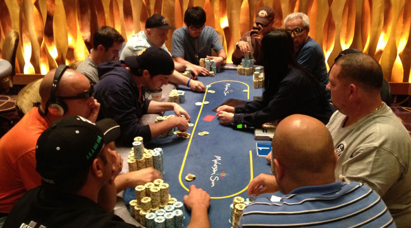 men playing poker at Mohegan Sun Casino